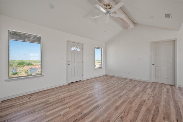 entryway featuring ceiling fan, lofted ceiling with beams, and light wood-type flooring