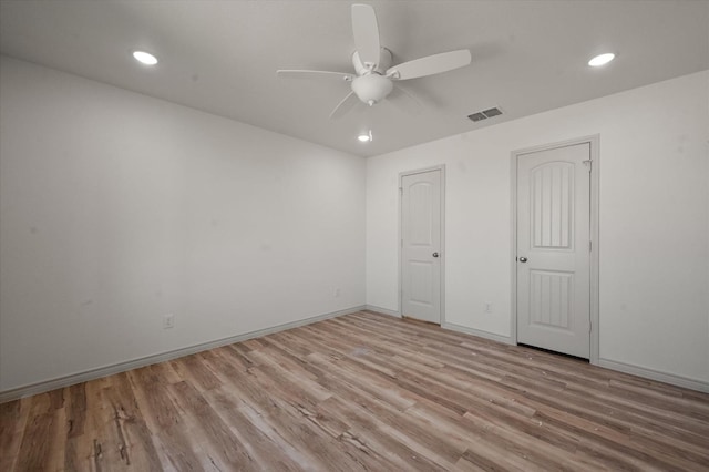 unfurnished bedroom featuring ceiling fan and light hardwood / wood-style flooring