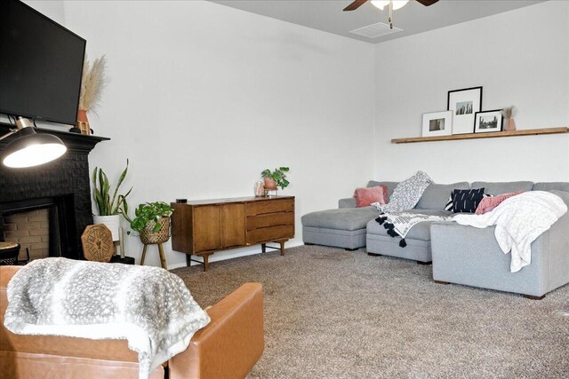 7502 103rd St, Lubbock, TX 79424 - living room with a ceiling fan, carpet, and a fireplace