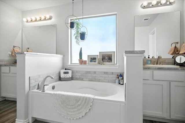 7502 103rd St, Lubbock, TX 79424 - bathroom featuring vanity and a garden tub