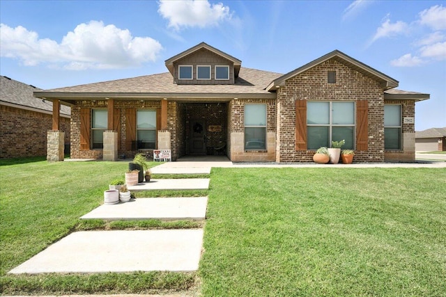 7502 103rd St, Lubbock, TX 79424 - view of front of house with a front lawn, brick siding, and roof with shingles