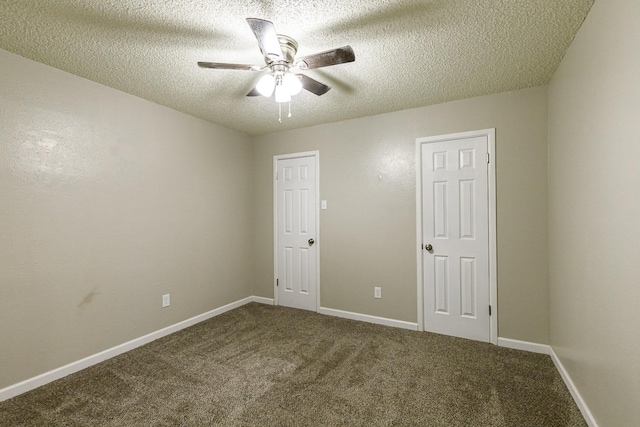 carpeted spare room with a textured ceiling and ceiling fan