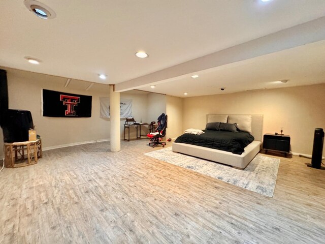 bedroom with hardwood / wood-style flooring