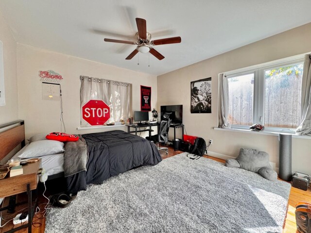 bedroom with hardwood / wood-style flooring and ceiling fan