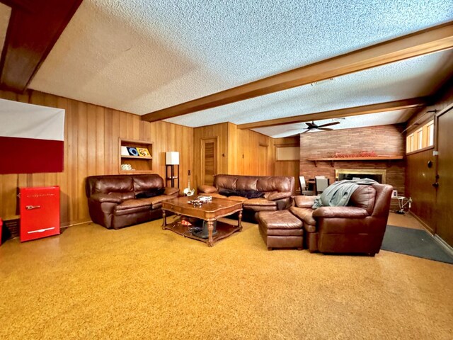 living room featuring a textured ceiling, beamed ceiling, and wood walls