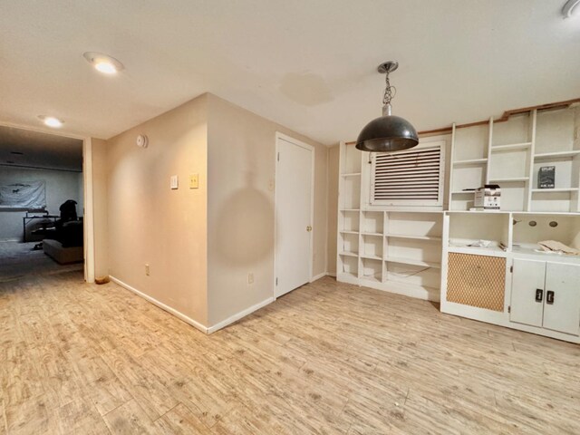 spare room with light hardwood / wood-style flooring