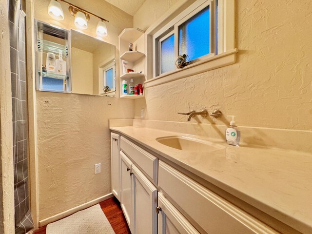 bathroom featuring vanity and hardwood / wood-style flooring