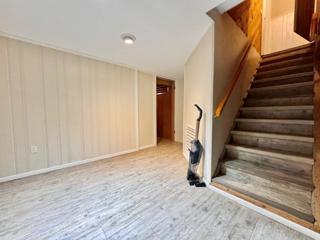 staircase featuring hardwood / wood-style flooring