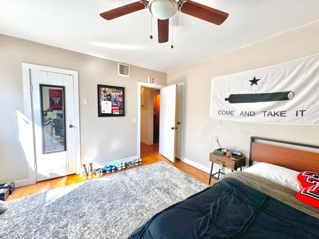 bedroom with ceiling fan and light hardwood / wood-style flooring