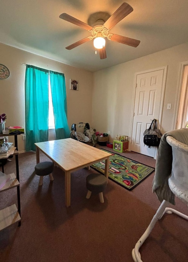 playroom featuring ceiling fan and carpet flooring