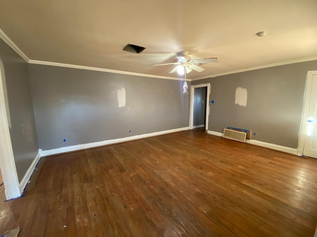 empty room featuring dark hardwood / wood-style flooring, crown molding, and ceiling fan