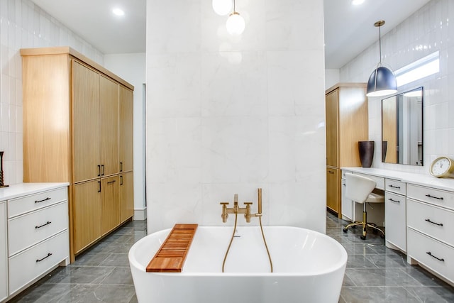 bathroom with a tub to relax in and tile walls