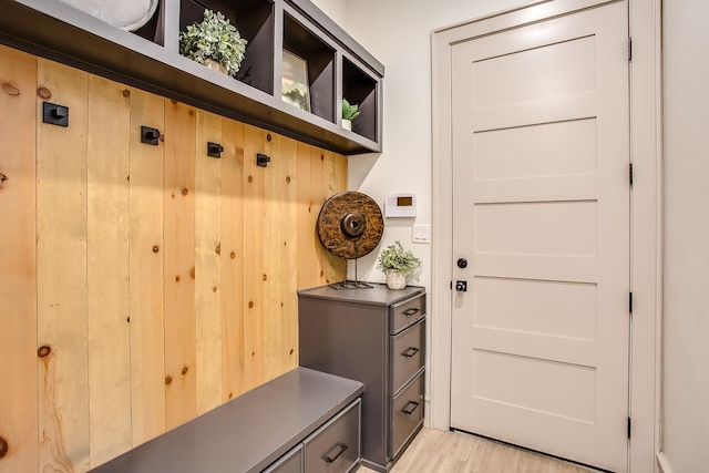 mudroom with light hardwood / wood-style flooring