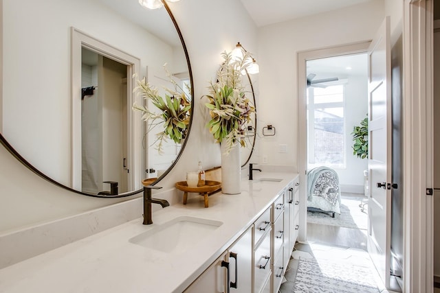 bathroom with vanity and wood-type flooring