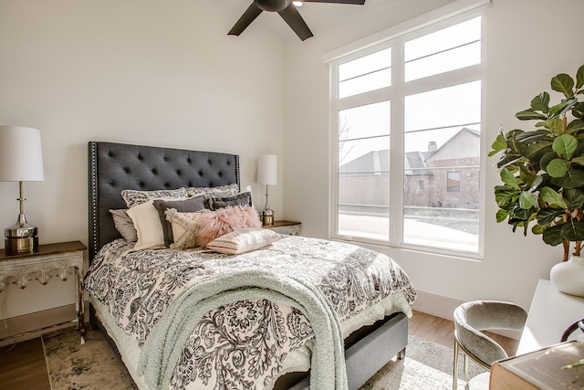 bedroom with ceiling fan and wood-type flooring