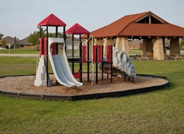 community playground featuring a yard