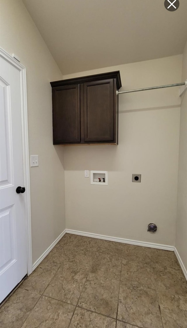 laundry area featuring hookup for an electric dryer, cabinet space, washer hookup, and baseboards