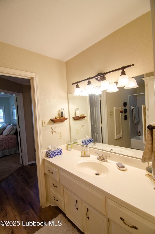 12220 Chicago Ave, Lubbock, TX 79424 - bathroom with vanity, wood finished floors, ensuite bath, and a shower