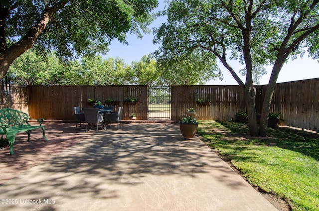 12220 Chicago Ave, Lubbock, TX 79424 - fenced backyard with outdoor dining space and a patio area
