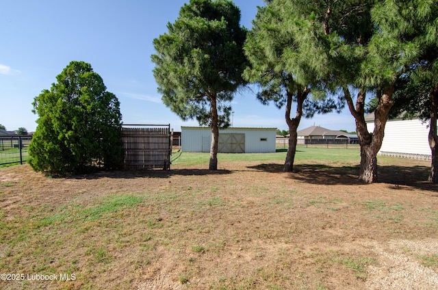 12220 Chicago Ave, Lubbock, TX 79424 - view of yard featuring an outbuilding and an outdoor structure