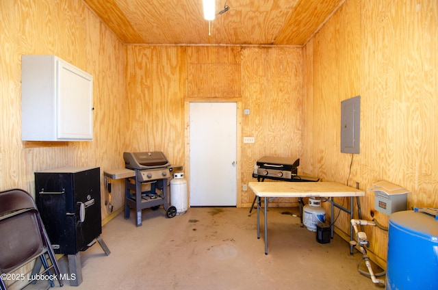 12220 Chicago Ave, Lubbock, TX 79424 - miscellaneous room featuring electric panel, wooden ceiling, concrete flooring, wooden walls, and an office area