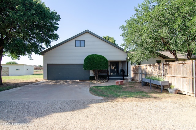 12220 Chicago Ave, Lubbock, TX 79424 - view of front of property with a garage and concrete driveway