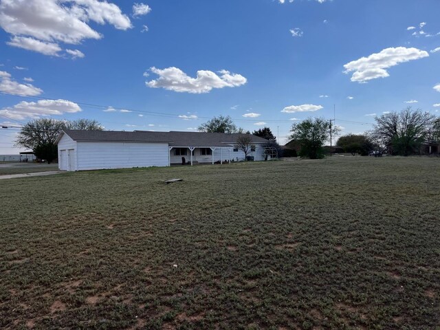 view of yard with a garage