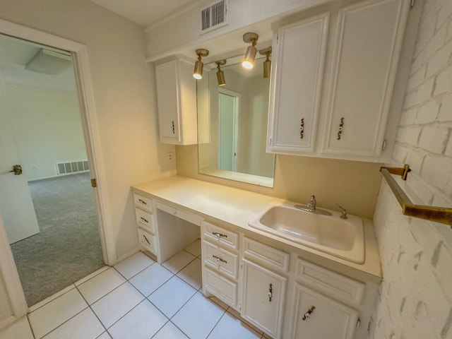 bathroom featuring tile patterned flooring and vanity