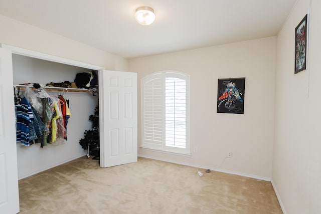 4906 Grinnell St, Lubbock, TX 79416 - unfurnished bedroom featuring light colored carpet, a closet, and baseboards