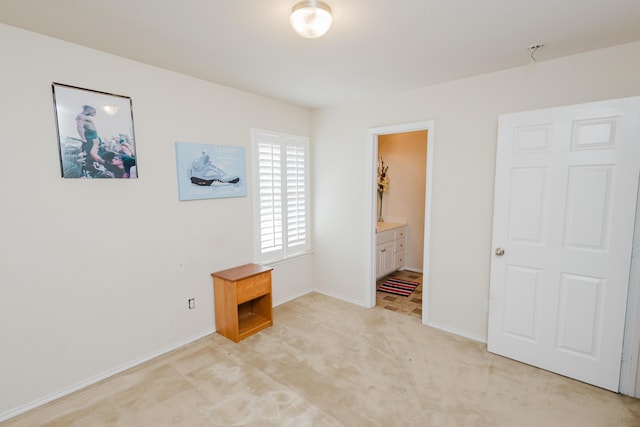 4906 Grinnell St, Lubbock, TX 79416 - unfurnished bedroom featuring light colored carpet, baseboards, and ensuite bath