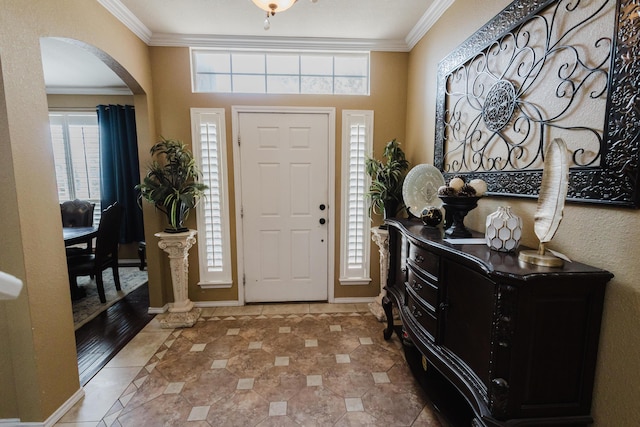 4906 Grinnell St, Lubbock, TX 79416 - foyer with arched walkways, ornamental molding, healthy amount of natural light, and baseboards