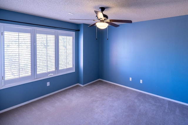 544 S US Highway 87, Wilson, TX 79381 - carpeted spare room with baseboards, a ceiling fan, and a textured ceiling