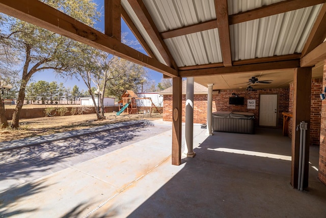 544 S US Highway 87, Wilson, TX 79381 - view of patio / terrace with a ceiling fan, a fenced backyard, and a playground