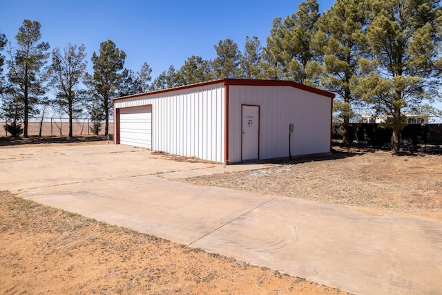 544 S US Highway 87, Wilson, TX 79381 - detached garage featuring fence and concrete driveway