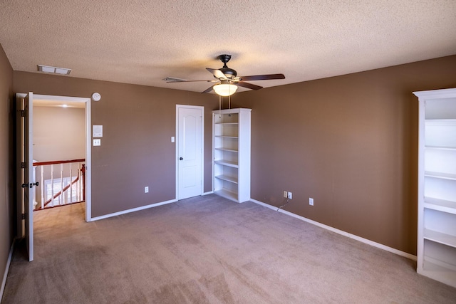 544 S US Highway 87, Wilson, TX 79381 - unfurnished bedroom featuring baseboards, carpet flooring, a textured ceiling, and visible vents