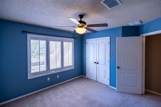 544 S US Highway 87, Wilson, TX 79381 - unfurnished bedroom with carpet floors, baseboards, visible vents, and a closet