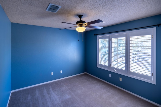 544 S US Highway 87, Wilson, TX 79381 - carpeted spare room featuring visible vents, a ceiling fan, baseboards, and a textured ceiling