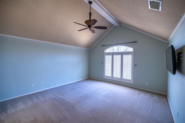 544 S US Highway 87, Wilson, TX 79381 - carpeted spare room featuring ceiling fan, a textured ceiling, baseboards, vaulted ceiling with beams, and ornamental molding