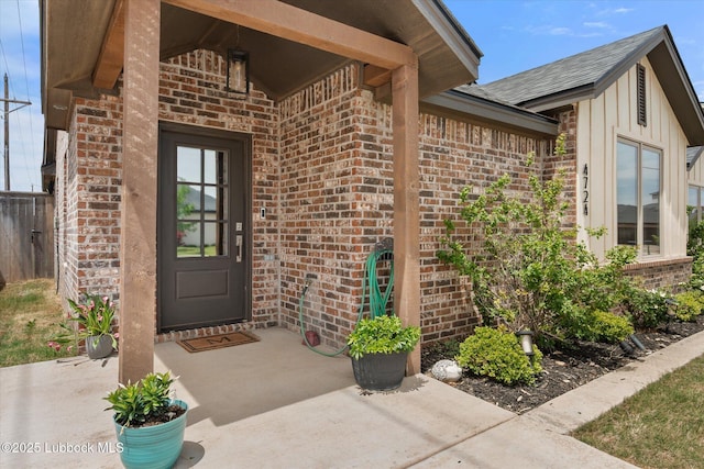 4724 121st Pl, Lubbock, TX 79424 - entrance to property featuring brick siding, board and batten siding, and roof with shingles