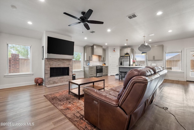 4724 121st Pl, Lubbock, TX 79424 - living room featuring baseboards, plenty of natural light, ceiling fan, and recessed lighting