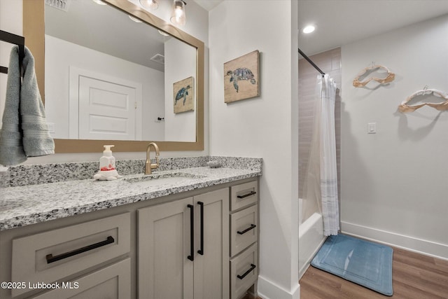 4724 121st Pl, Lubbock, TX 79424 - full bath featuring wood finished floors, baseboards, vanity, and shower / tub combo with curtain