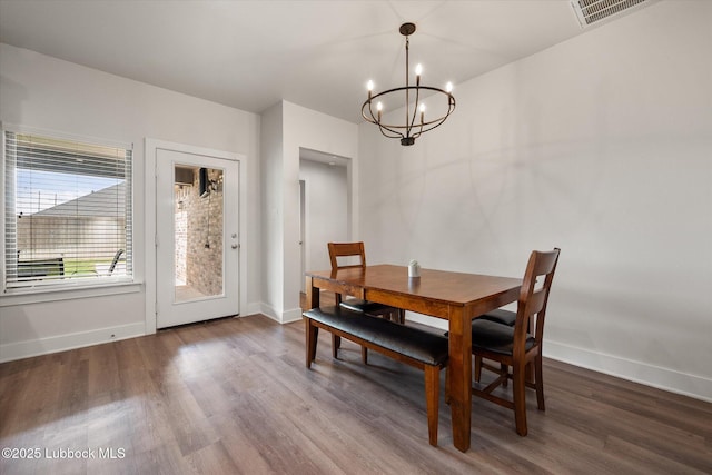 4724 121st Pl, Lubbock, TX 79424 - dining room with a chandelier, baseboards, and wood finished floors