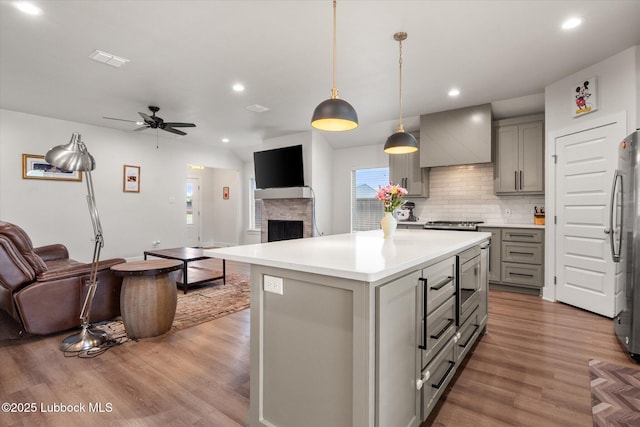 4724 121st Pl, Lubbock, TX 79424 - kitchen with gray cabinetry, open floor plan, recessed lighting, and wood finished floors
