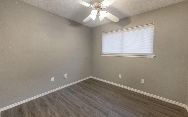 spare room featuring ceiling fan, dark hardwood / wood-style floors, and a textured ceiling