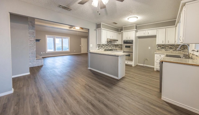 kitchen featuring white cabinetry, appliances with stainless steel finishes, and sink