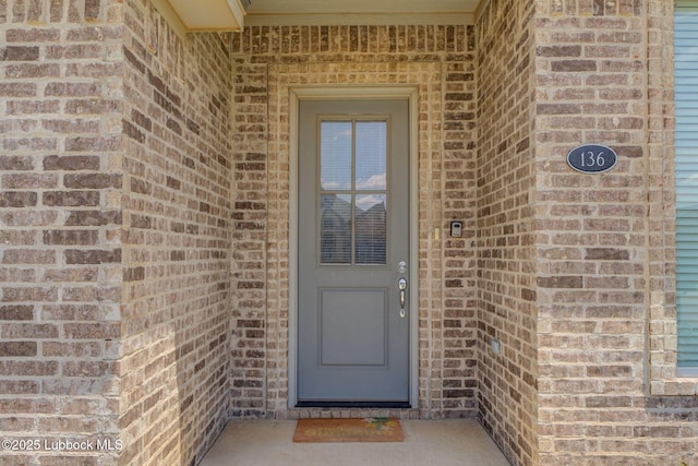 136 Preston Hollow Ln, Wolfforth, TX 79382 - property entrance featuring brick siding
