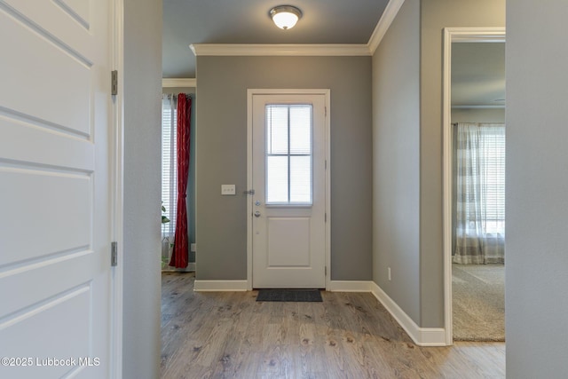 136 Preston Hollow Ln, Wolfforth, TX 79382 - entrance foyer featuring crown molding and light wood-style floors