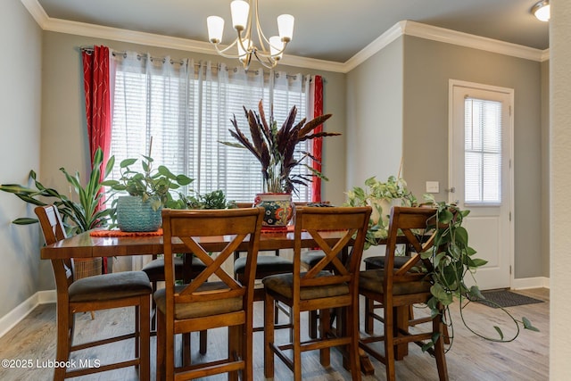 136 Preston Hollow Ln, Wolfforth, TX 79382 - dining space featuring a chandelier, wood finished floors, and crown molding