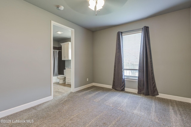 136 Preston Hollow Ln, Wolfforth, TX 79382 - spare room with light carpet, ceiling fan, and a smoke detector