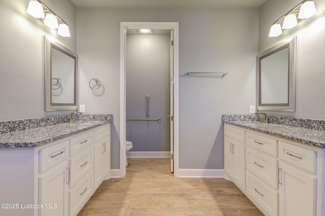 136 Preston Hollow Ln, Wolfforth, TX 79382 - full bathroom with wood finished floors and vanity